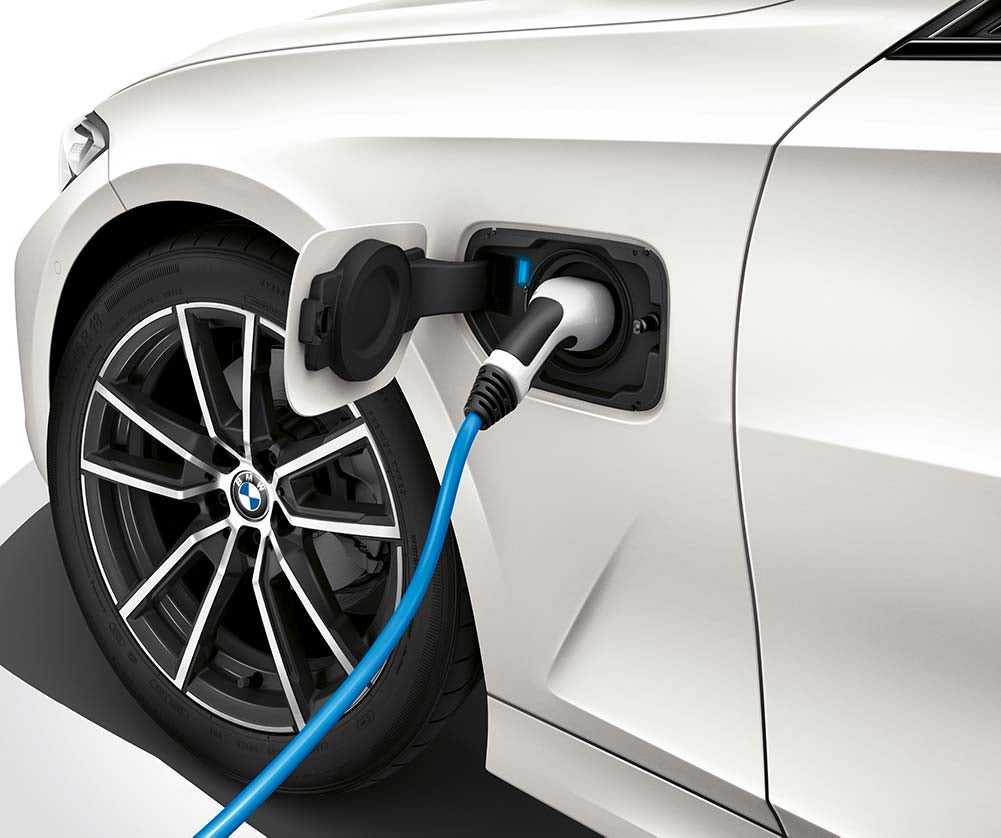 BMW vehicle plugged into electric charging