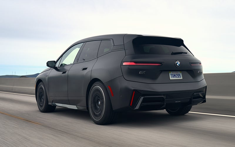 The BMW iX M70 driving rear shot. | BMW of Eugene in Eugene OR