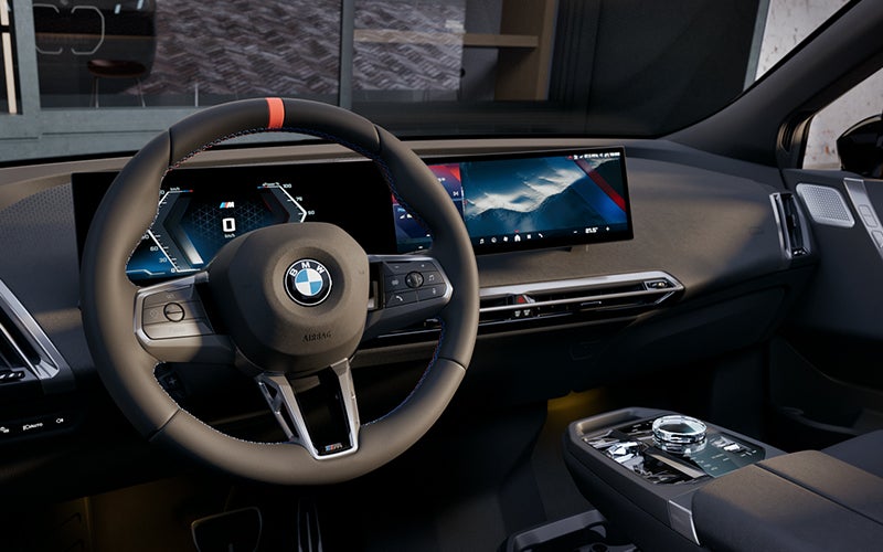 Interior steering wheel and dashboard of the BMW iX M70. | BMW of Eugene in Eugene OR